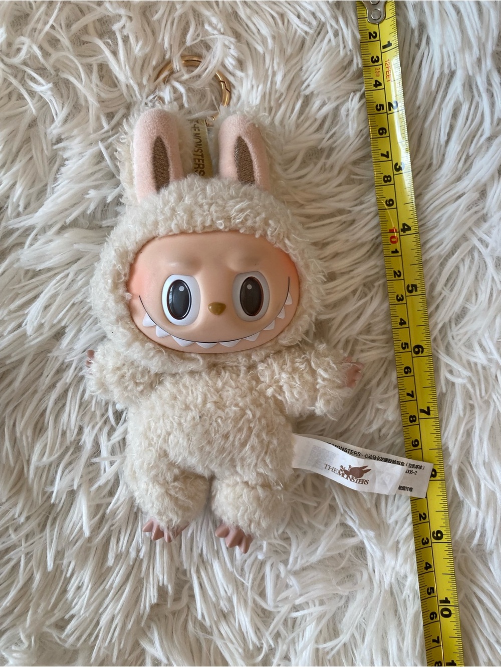 The Monsters Plush Bunny-Eared Keychain in Cream - The Monsters